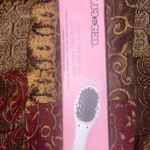 Plugged in straightening brush/brand new